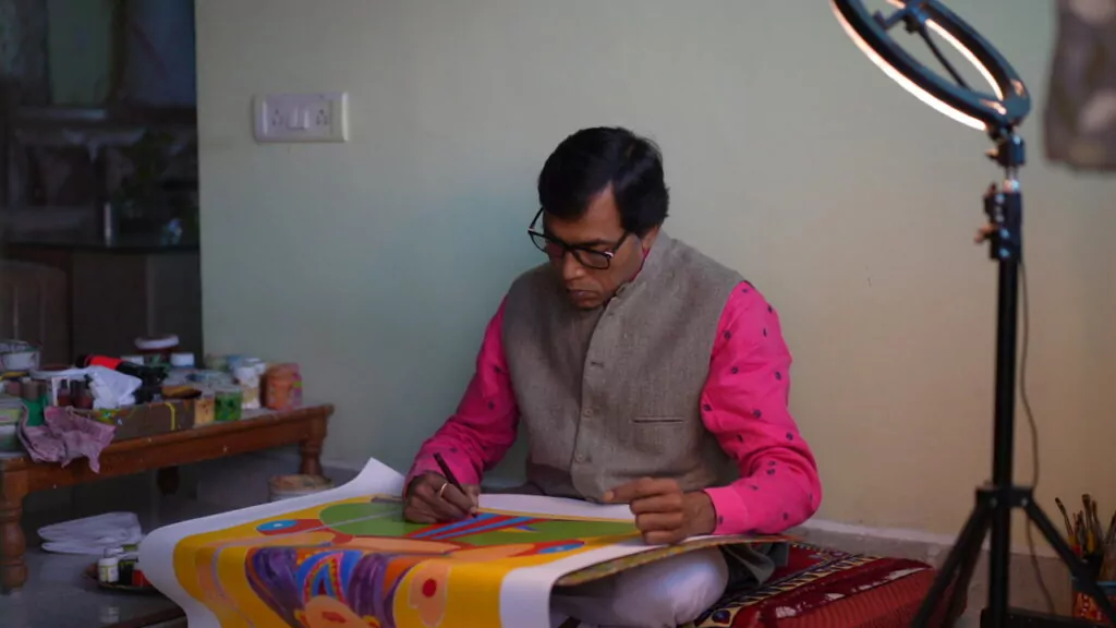 Artist Venkat Shyam creating Gond Painting