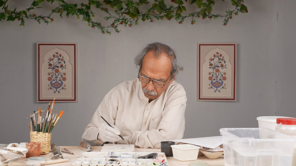 Dr. Bhawani Shankar Sharma teaching how to make a fresco painting on Rooftop app.